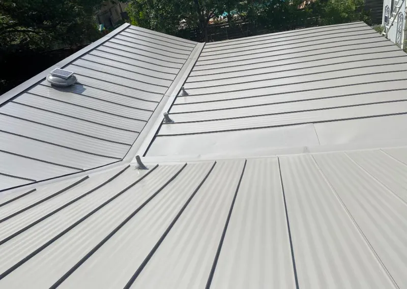 Solar attic fan installed on a metal roof for Roof Ventilation in Newberg